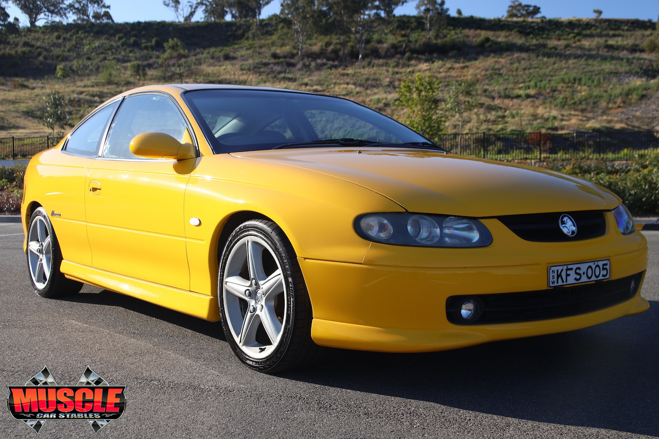 2002 Holden Monaro CV8 Devil Yellow -Front three-quarter view