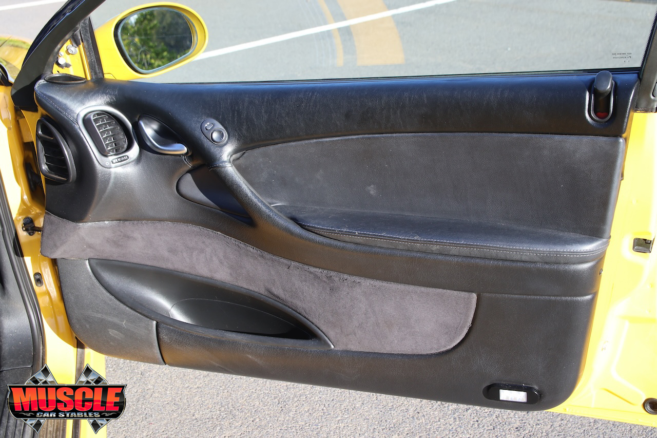 2002 Holden Monaro CV8 Devil Yellow - drivers door trim