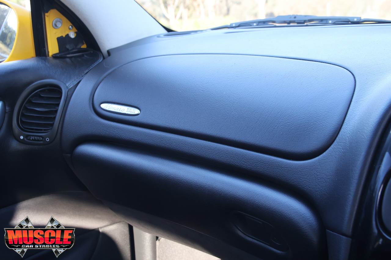 2002 Holden Monaro CV8 Devil Yellow - passenger dash